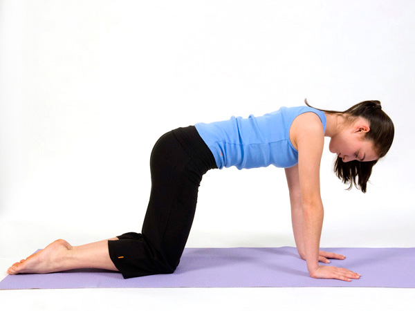Tabletop pose helps stretch the spine.
